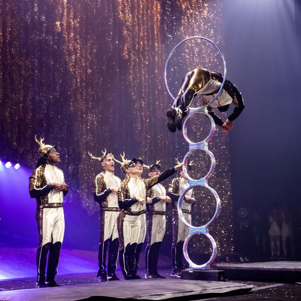 Man in Reindeer costume jumping through loops in the air - Cirque du Soliel Theater at MSG